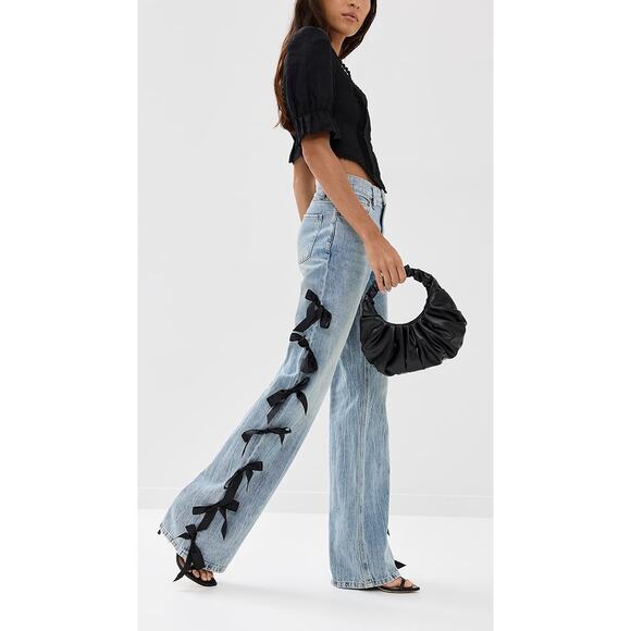 Alice + Olivia Blue Flare Jeans with Black Bow Accents - Picture 2 of 12